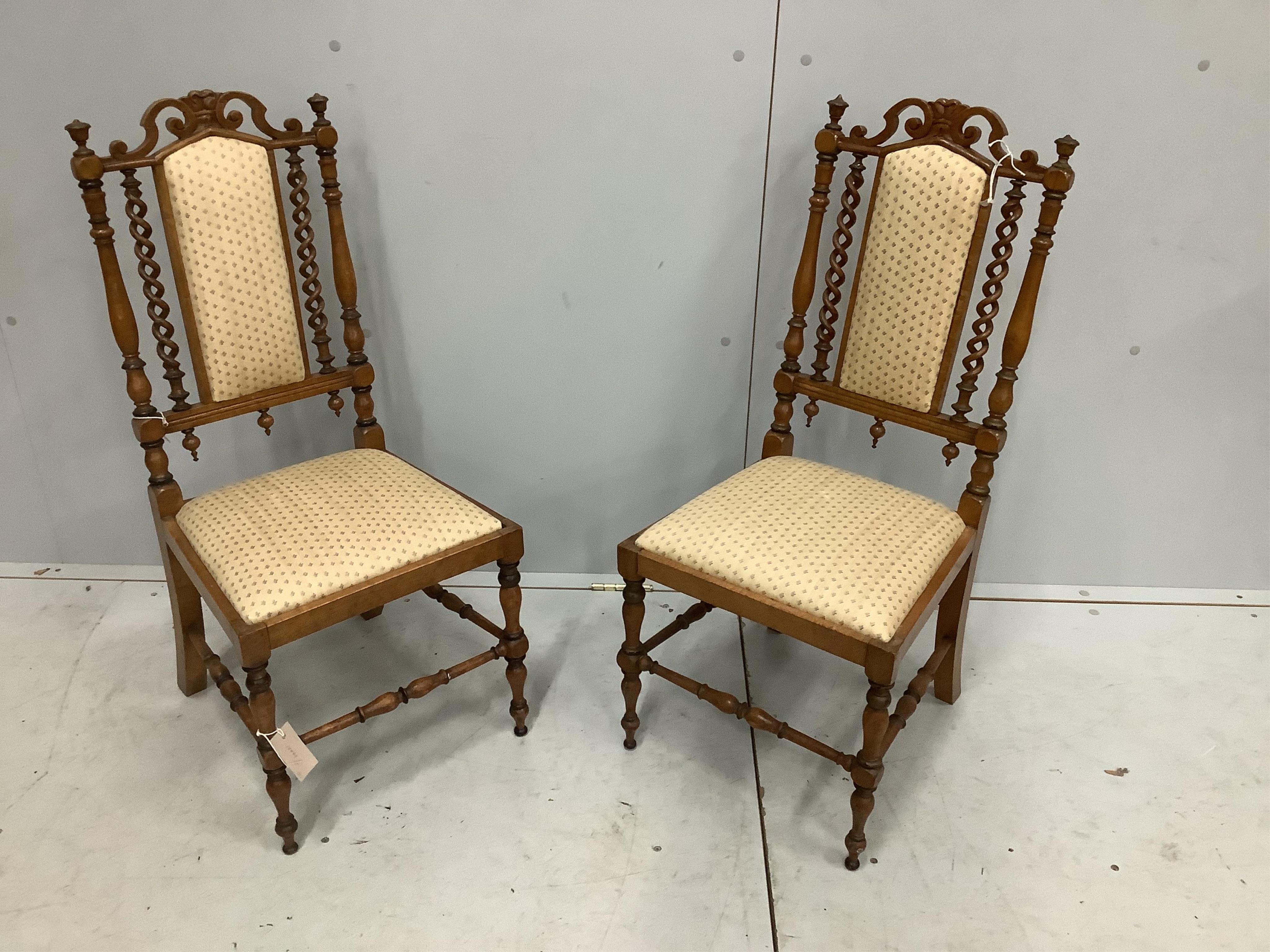 A pair of late Victorian turned mahogany side chairs, width 39cm, depth 36cm, height 86cm. Condition - fair